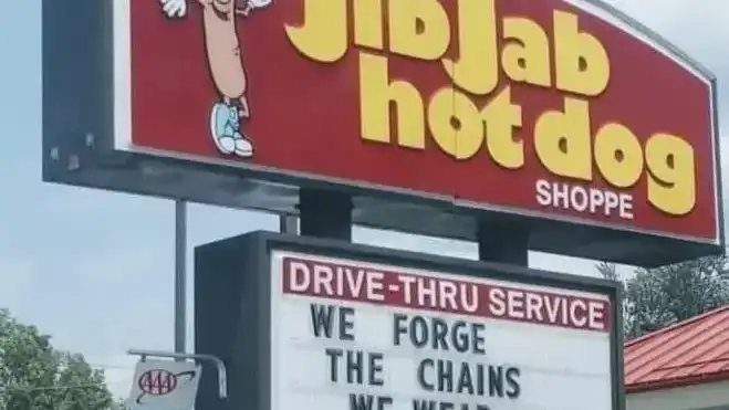 JibJab hot dog sign says 'we forge the chains we wear in life', a quote from Jacob Marley in A Christmas Carol, the first of four ghosts to visit Scrooge