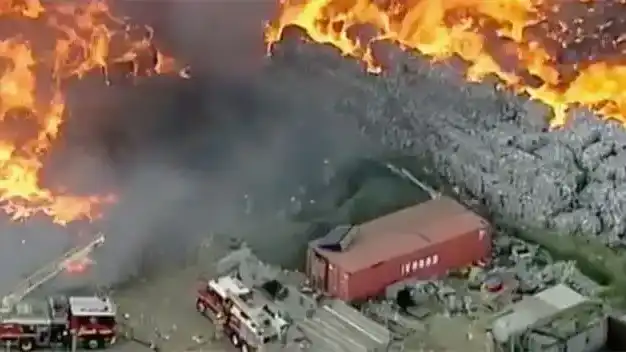 aerial photo of a melbourne recycling facility - bales of soft plastics etc ablaze